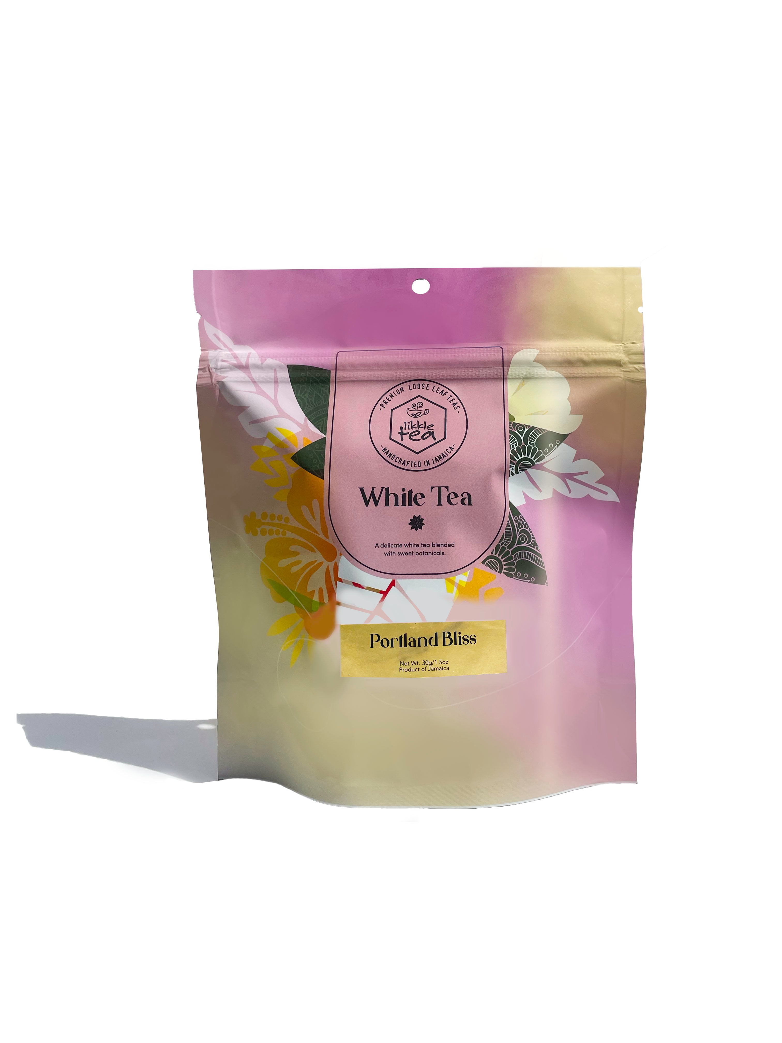 Tea bag packaging with floral design and 'White Tea' label on a white background