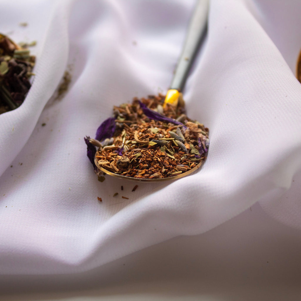 Close-up of dried herbs on a white fabric background